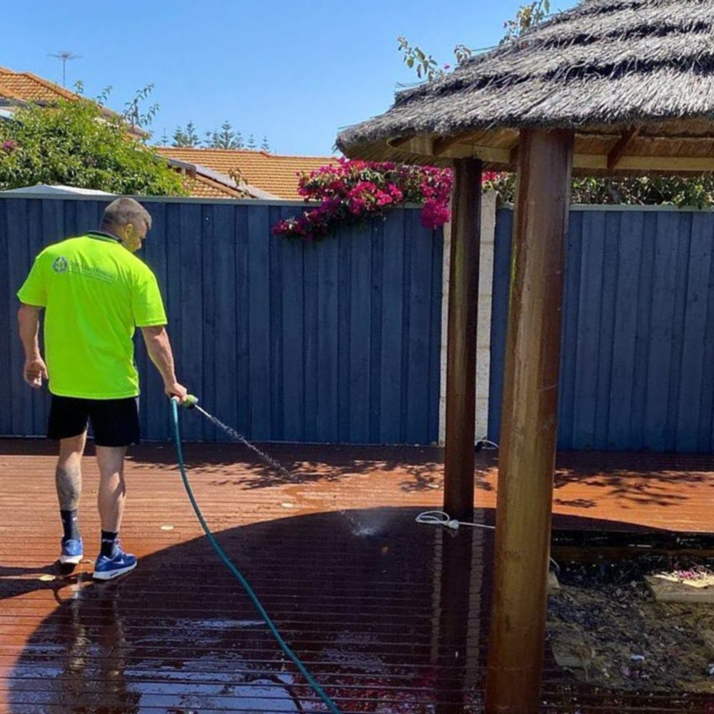 Cleaning the clients backyard after waste removal, providing the full service to Perth customers.